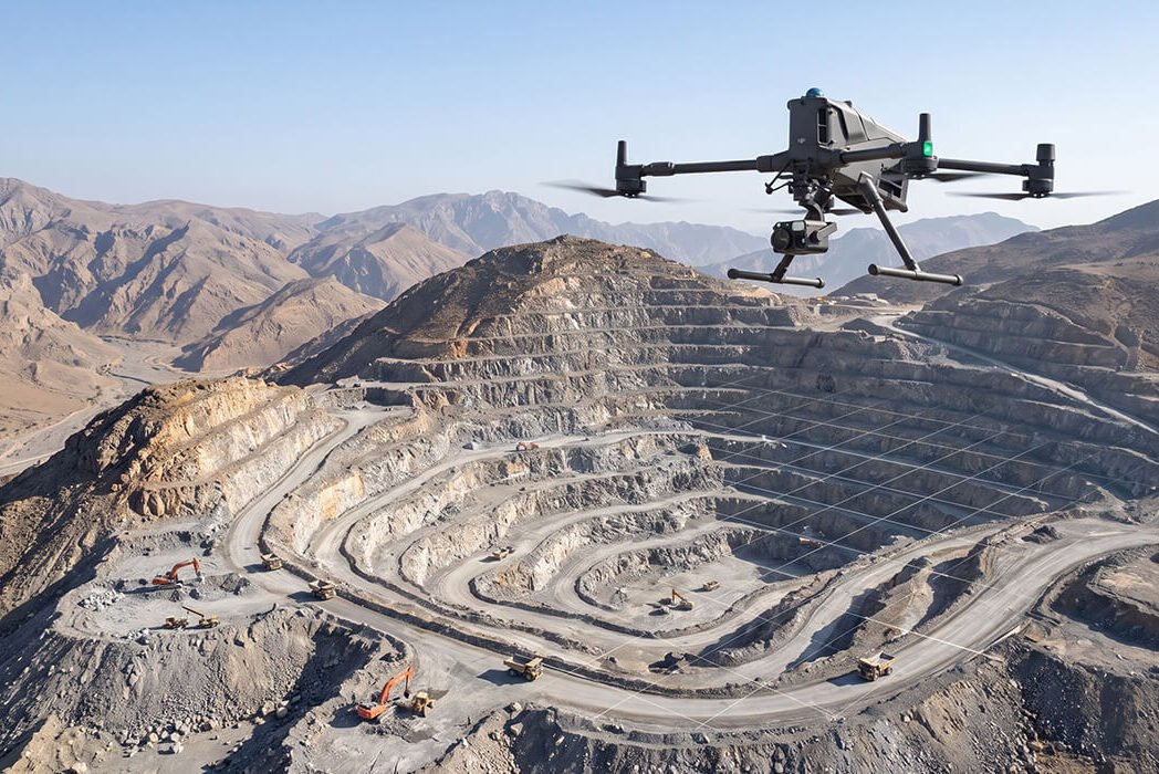 Survey drone flying over a quarry to capture overlapping photos for one accurate aerial map